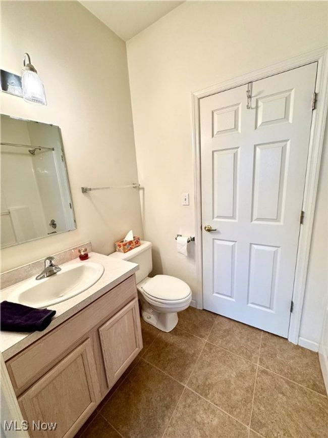 Bathroom featuring vanity, tile patterned floors, and toilet | Image 12