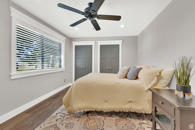 Bedroom with ceiling fan and hardwood / wood-style floors | Image 17