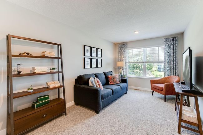 The upstairs loft is sure to become a family favorite hangout spot, close by each of the home's four upper level bedrooms! Photo of model home, color & options may vary. | Image 13