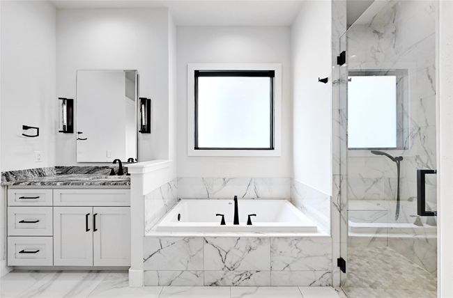 Full bath with vanity, a garden tub, marble finish floor, and a marble finish shower | Image 18