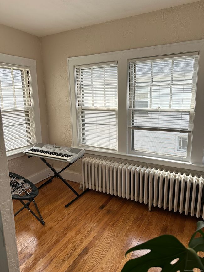 Sun porch/home office/study room/library adjacent to the living room | Image 6