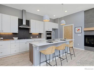 Gourmet kitchen with KitchenAid appliance package and refrigerator | Image 3