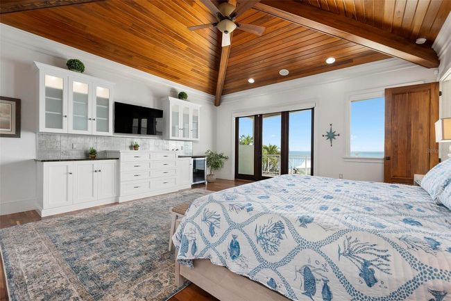 Primary bedroom with sliding doors to the balcony overlooking the intracoastal bay water views | Image 40