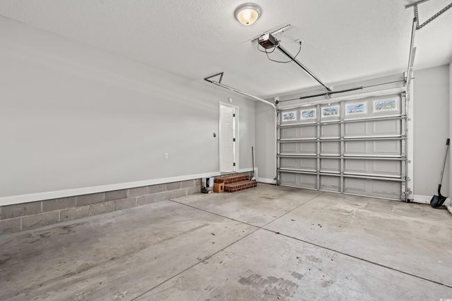 Garage with a garage door opener | Image 27