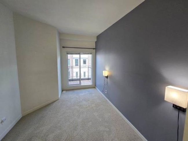 Carpeted empty room featuring baseboards | Image 11