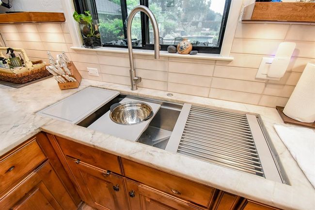 A close up of the oversized Galley kitchen sink, offering a drying rack, cuting board and strainer for easy meal prep and clean up! | Image 19