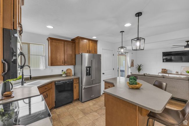 Kitchen featuring an open floor plan with included stainless steel appliances, and a large island | Image 4
