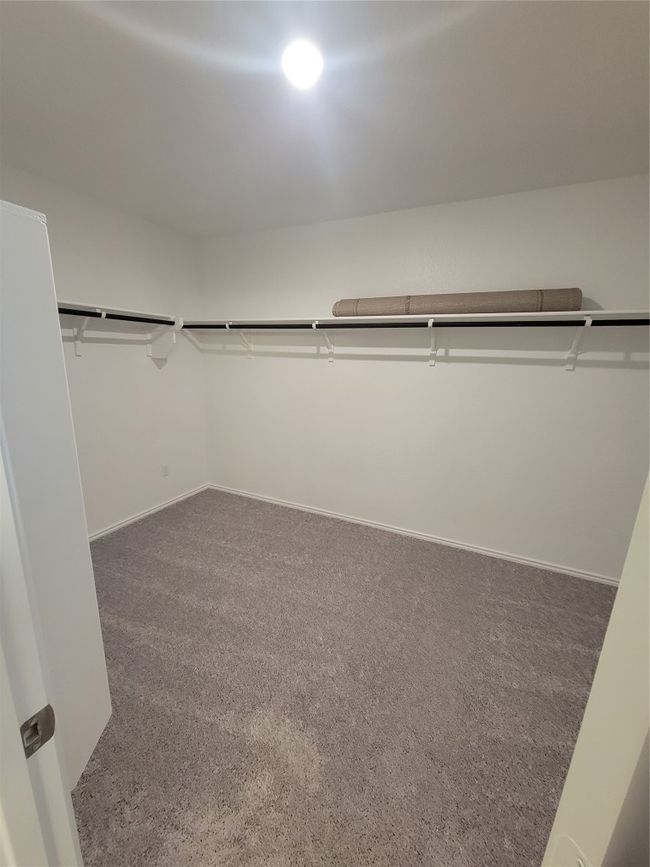 Spacious closet with carpet floors | Image 23