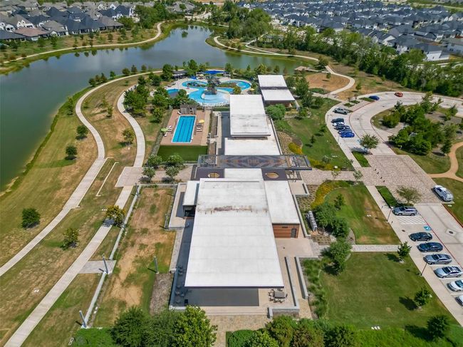 Features a single-family home with a spacious yard in Bridgeland, a master-planned community offering lakes, pools, sidewalks, and green spaces. | Image 26