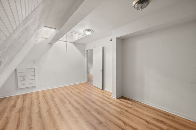 Additional living space with laminate floors | Image 26