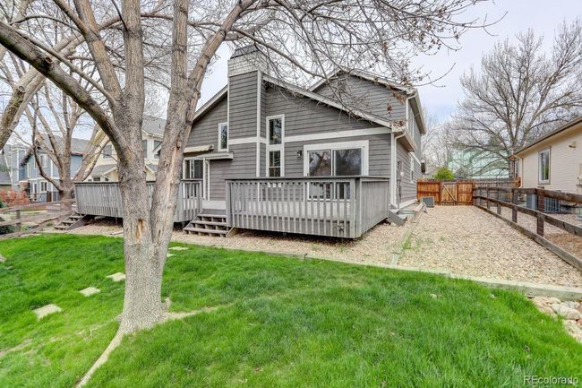 A park like backyard with an oversized deck | Image 17