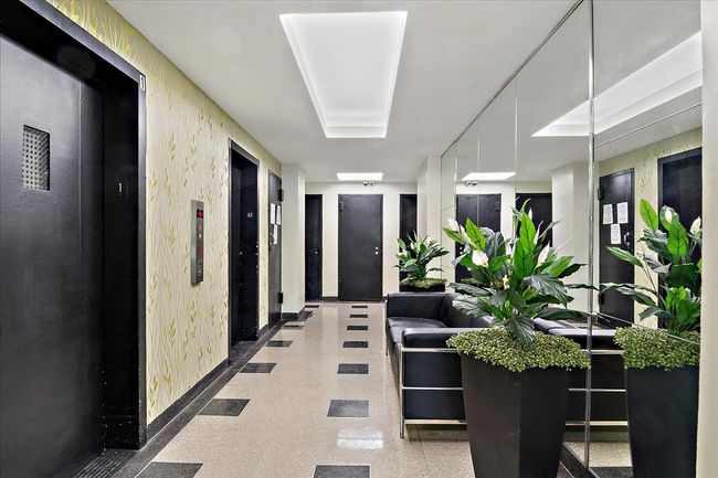 Corridor with elevator and baseboards | Image 17