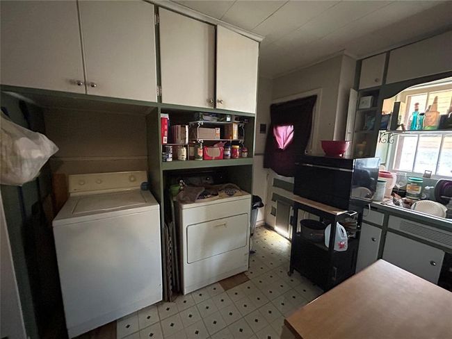 Empty room with plenty of natural light, wood finished floors, and baseboards | Image 10
