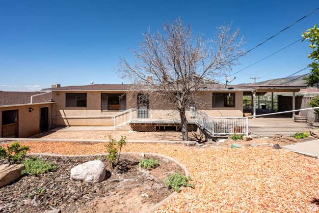 Back of house with stucco siding and a deck | Image 41
