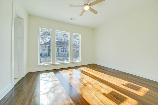 Unfurnished room with dark hardwood / wood-style floors and ceiling fan | Image 26