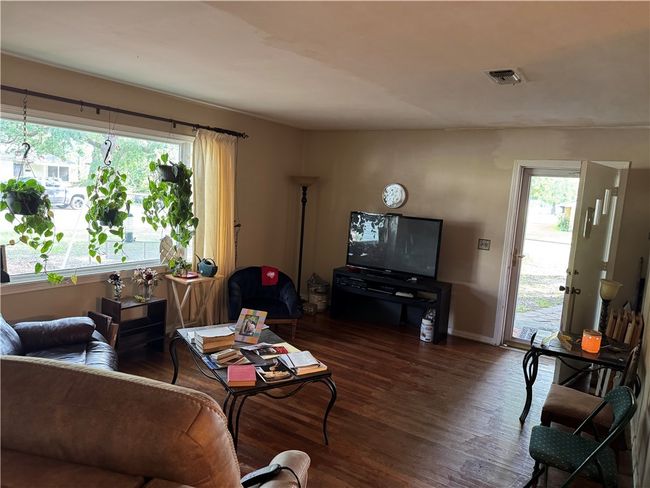 Living area with wood finished floors, healthy amount of natural light, and baseboards | Image 11