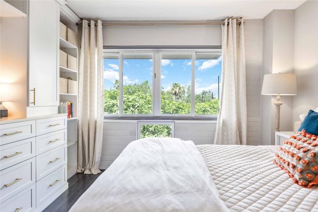 Custom made blackout curtains can be rolled down to provide privacy and light control. | Image 14