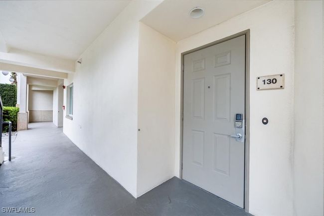 View of exterior entry door. Door has secured electronic key bad for guests | Image 22