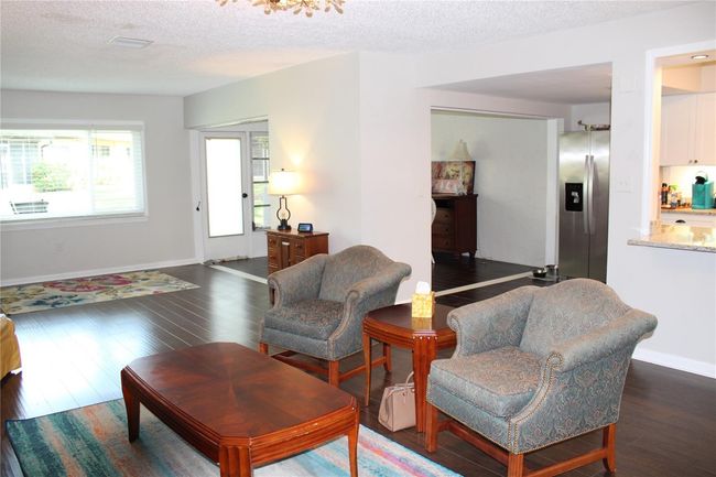 Family room looking towards dining room and patio door. | Image 5