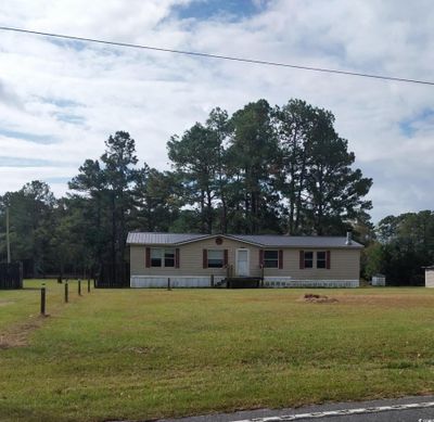 View of front of property with a front yard | Image 1