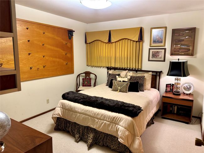 Bedroom featuring carpet and baseboards | Image 35