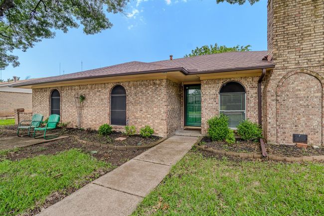 Ranch-style house with brick siding and roof with shingles | Image 4