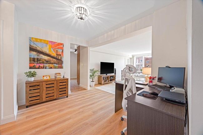 Office featuring light wood-type flooring and baseboards | Image 19
