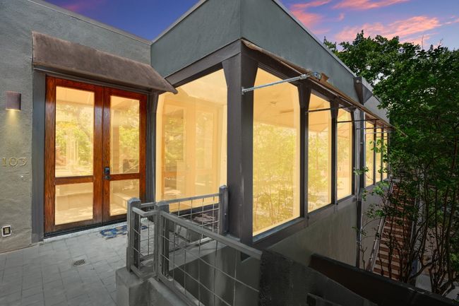 Twilight views, highlighting the expansive windows in the condo. | Image 9