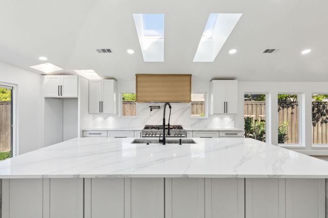 Additional storage with cabinets in island undermount. | Image 9