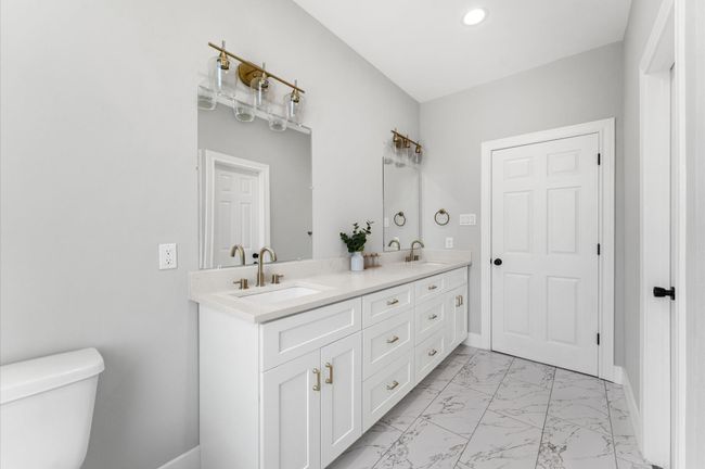 Elegant double sinks in the primary bathroom. | Image 17