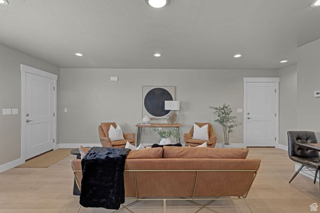 Living room featuring light wood-type flooring and recessed lighting | Image 4