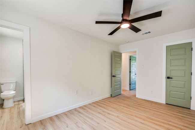 Unfurnished room with light wood-style flooring and ceiling fan | Image 17
