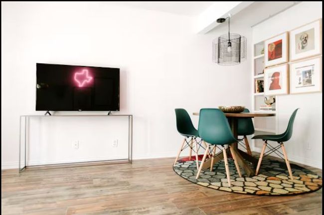 Dining area featuring wood finished floors and baseboards | Image 5