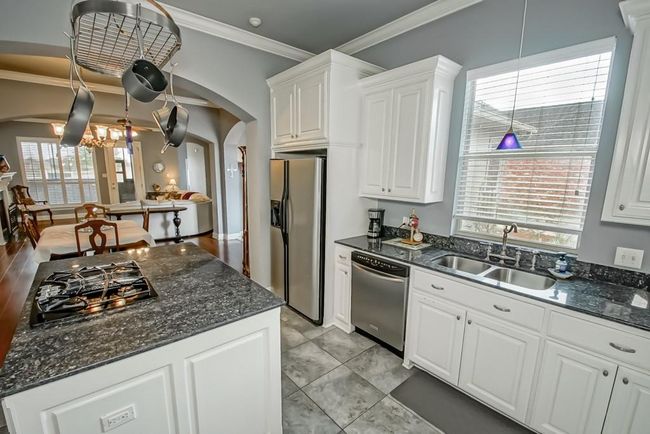 Blue pearl granite countertops! Ceiling pot rack can remain. | Image 13