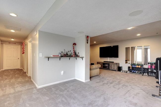 Lower-level rec room area open to family room | Image 37