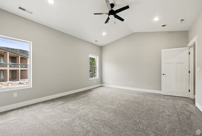 Unfurnished bedroom with recessed lighting, carpet flooring, lofted ceiling, baseboards, and ceiling fan | Image 27