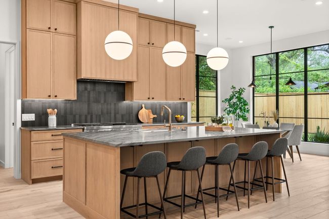 Large center island is the heart of the first floor with Quartzite countertops. | Image 9