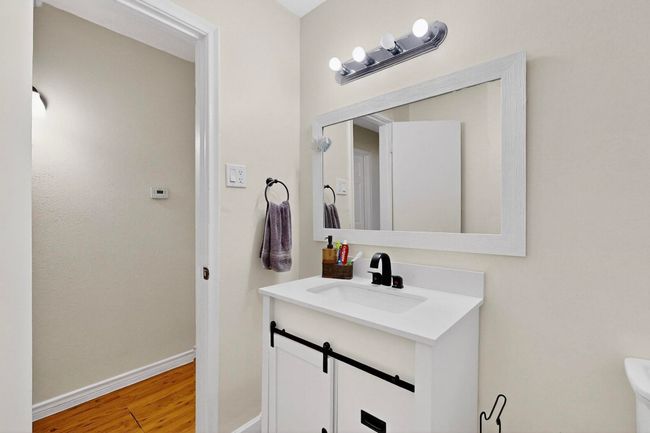 Bathroom with vanity and wood finished floors | Image 11