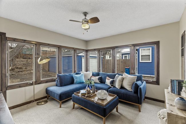 This beautiful three-season porch is situated just behind the garage and also accessed from the dining area. | Image 12