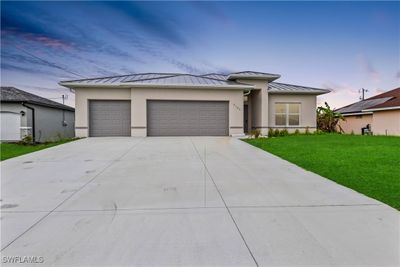 Sprawling driveway and three car garage - plenty of parking both indoors and outdoors! | Image 2