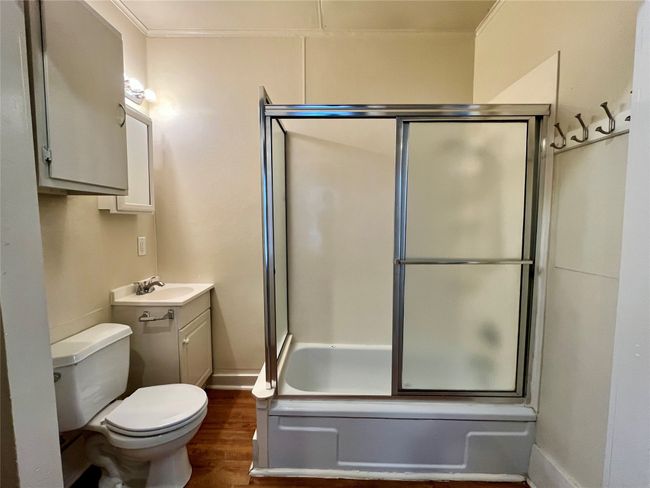 Here is a different view of the bathroom. | Image 7
