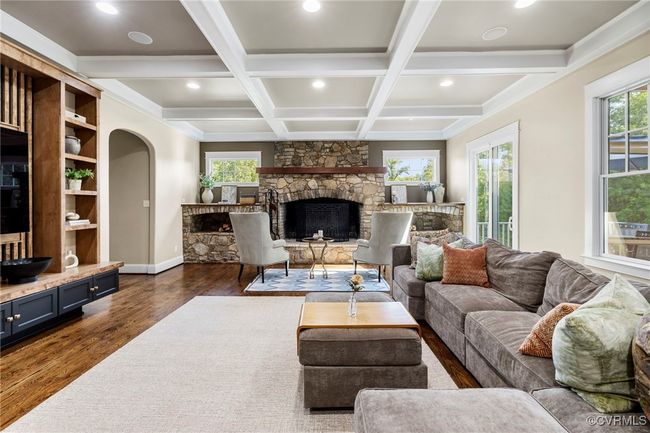 Living room featuring a fireplace, dark wood-style flooring, recessed lighting, coffered ceiling, and beam ceiling | Image 17
