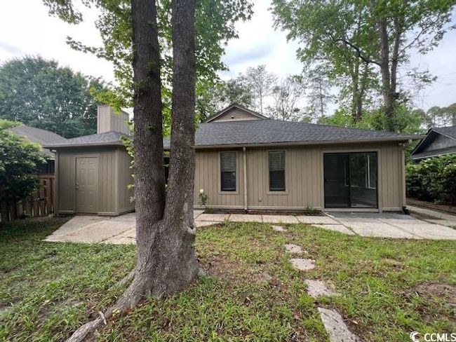 Rear view of house featuring a patio, roof with shingles, fence, and a lawn | Image 5