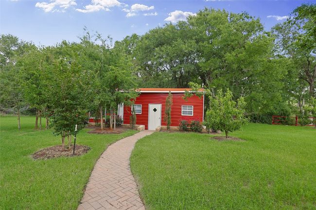 View of outdoor structure with an outbuilding | Image 28