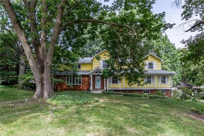 View of front of property featuring a front lawn | Image 1