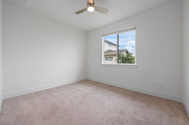 Spare room featuring carpet flooring and ceiling fan | Image 21