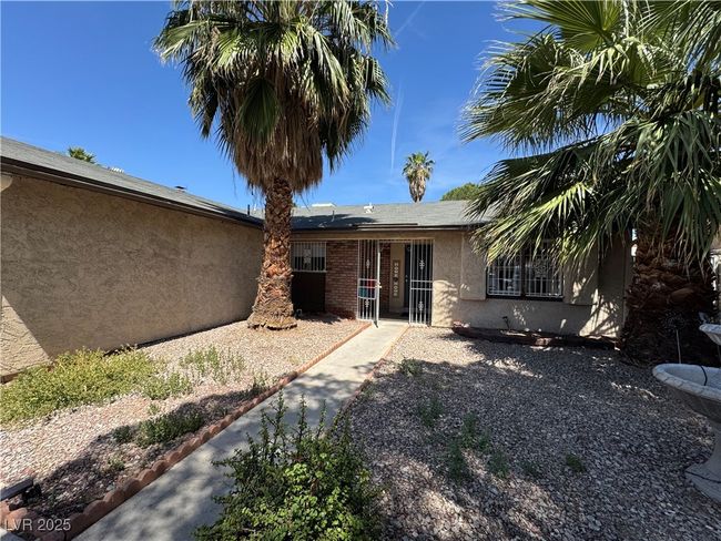 Rear view of house with stucco siding | Image 17