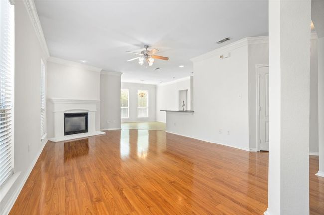 Welcome home! This home has a wonderful open floorplan with tons of natural light and a corner fireplace | Image 4