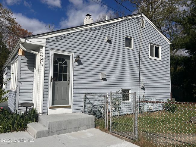 Side Entrance and Porch. Fenced in. Larger Lot. | Image 37