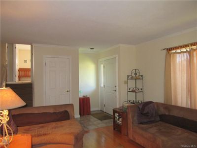 Living room with crown molding and wood-type flooring | Image 3